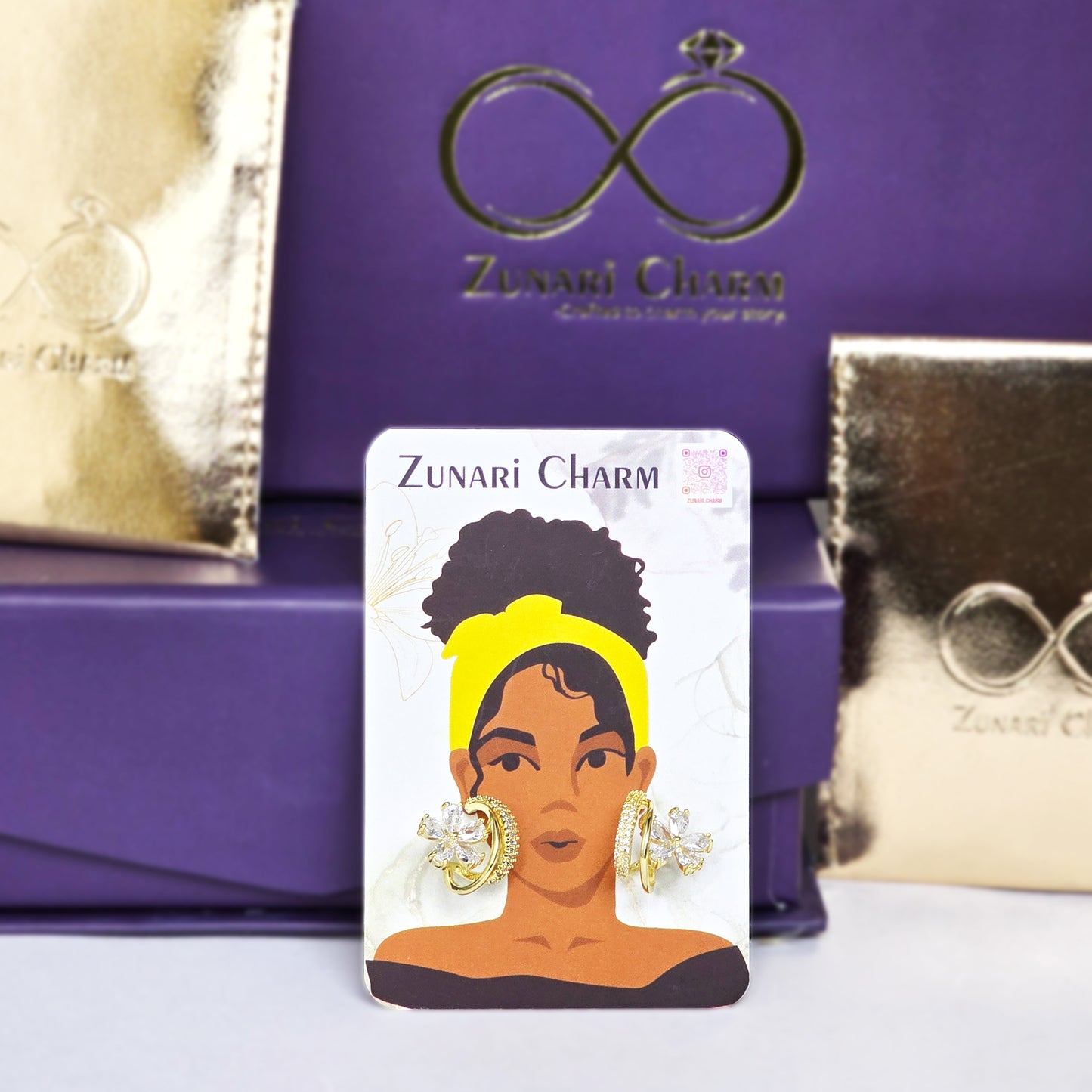 Zunari Charm floral earrings packaging and branding shot