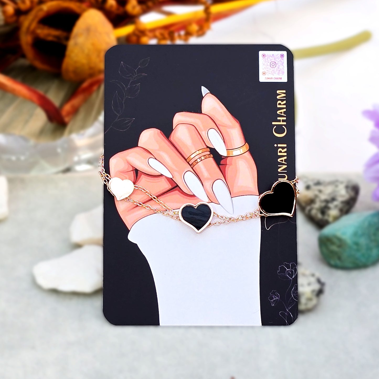 Full length view of the Heartstrings Bracelet displayed on Zunari Charm packaging.