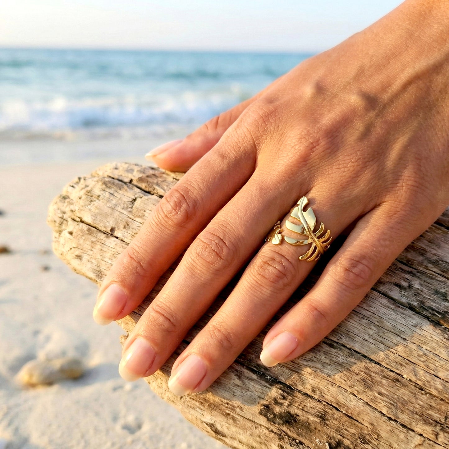 elegant gold ring on hand seaside aesthetic jewelry