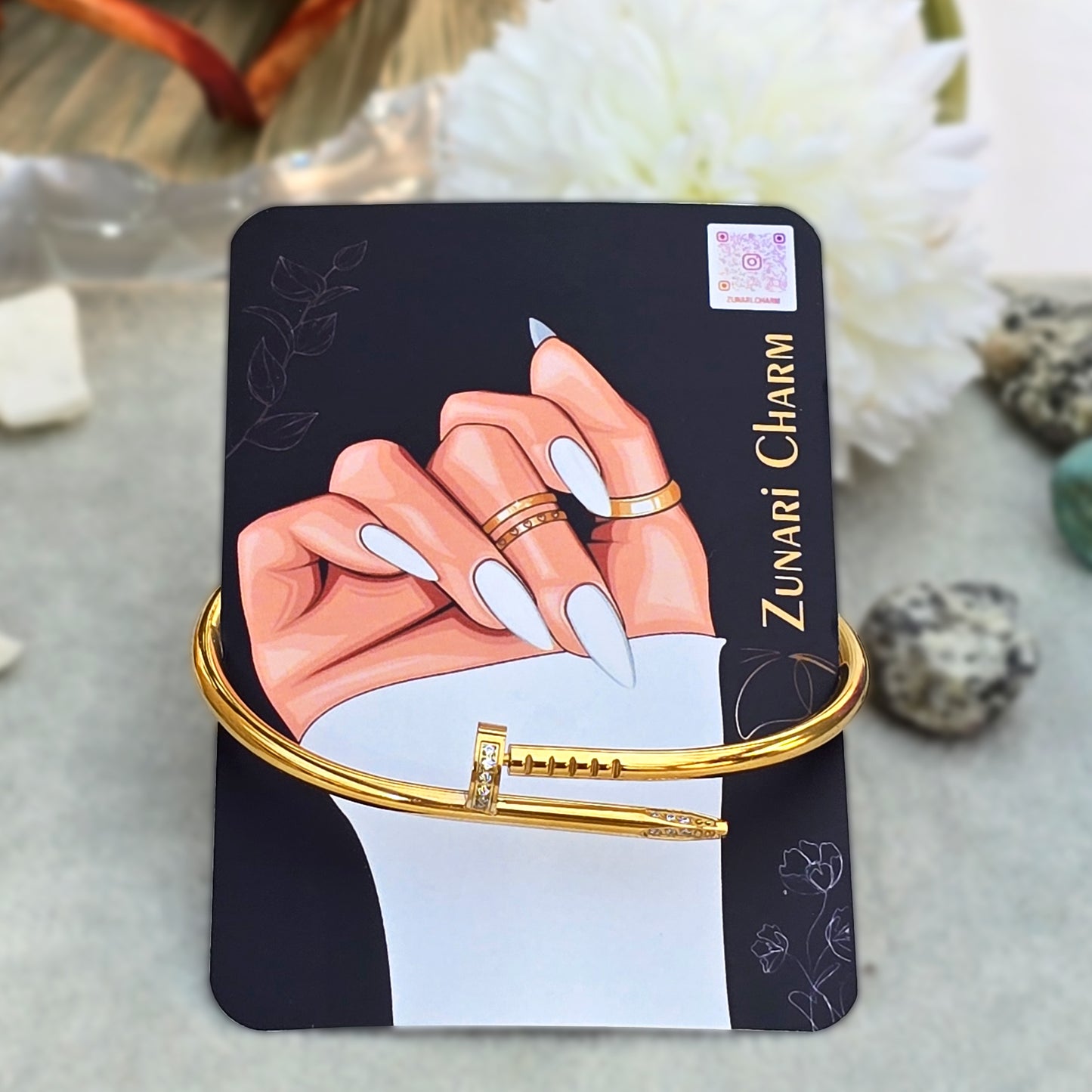Pavé Nail Bangle displayed on Zunari Charm branded packaging card.