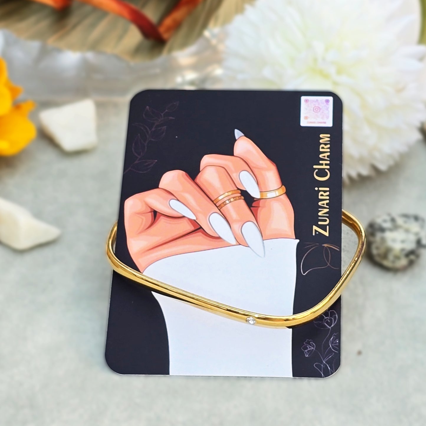 Rectangle Solitaire Bangle displayed on Zunari Charm branded packaging card.