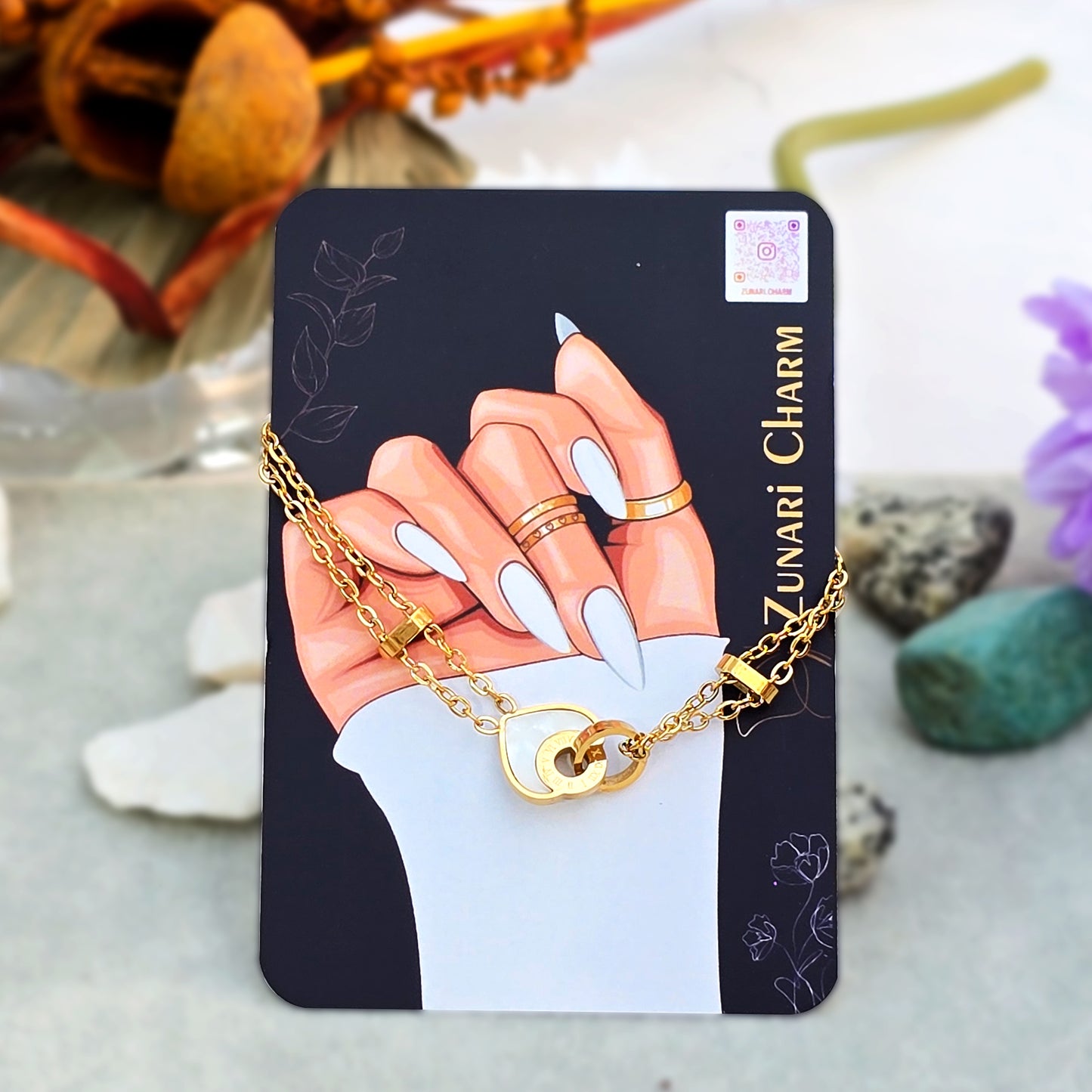 Starlight anti-tarnish bracelet displayed on Zunari Charm packaging.