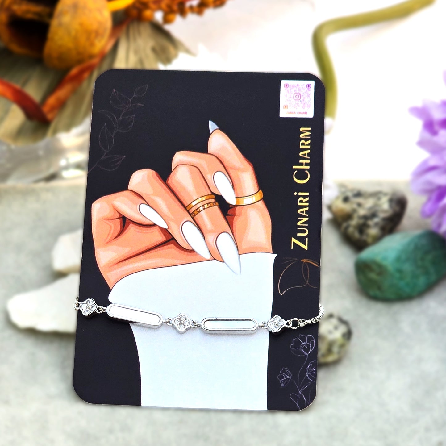 The Timeless Silver Brick Bracelet presented on the official Zunari Charm branding card.