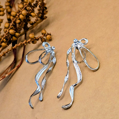 Silver Exaggerated Bow Dangle Earrings | Crystal Statement Jewelry