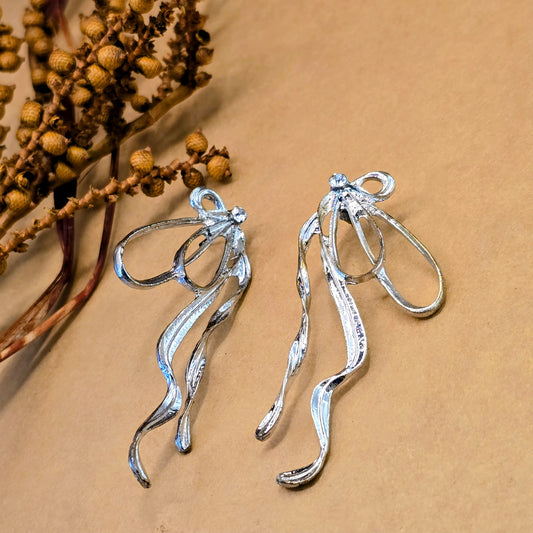 Silver Exaggerated Bow Dangle Earrings | Crystal Statement Jewelry