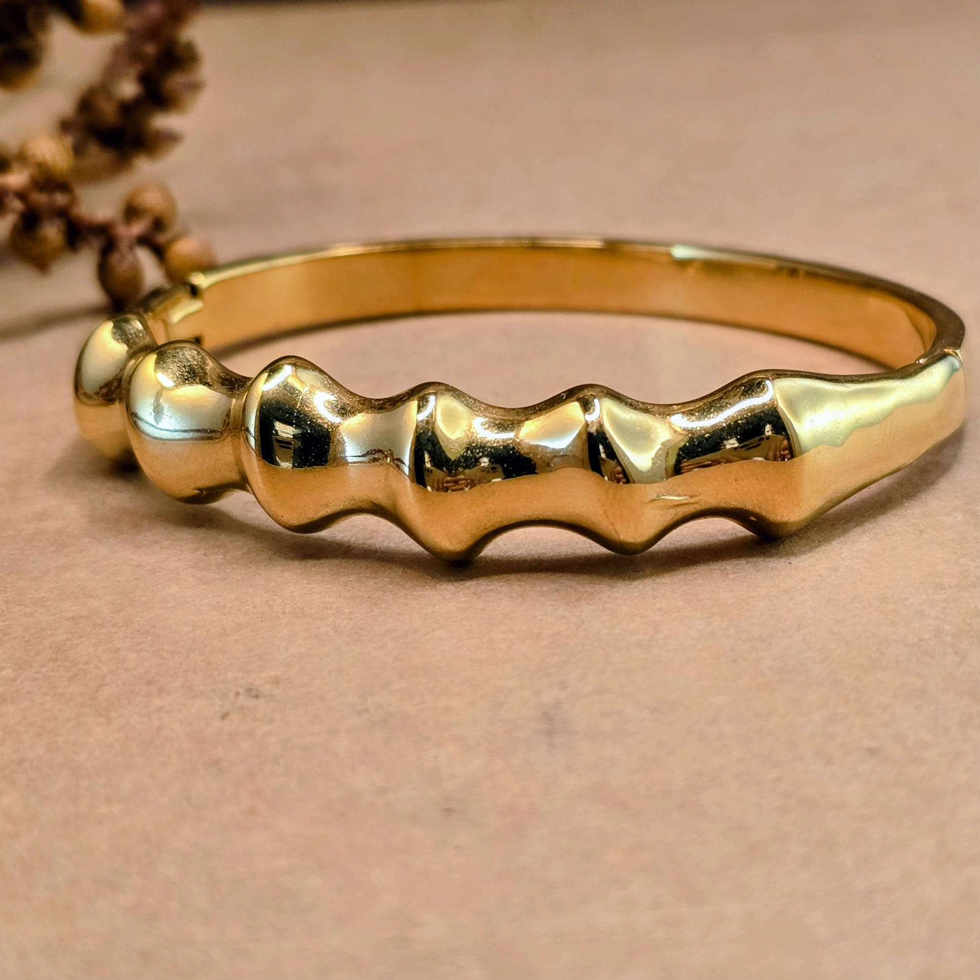 Close-up of Molten Ridge statement bracelet with molten texture