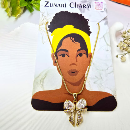 Necklace on Zunari Charm packaging card featuring elegant gold finish.