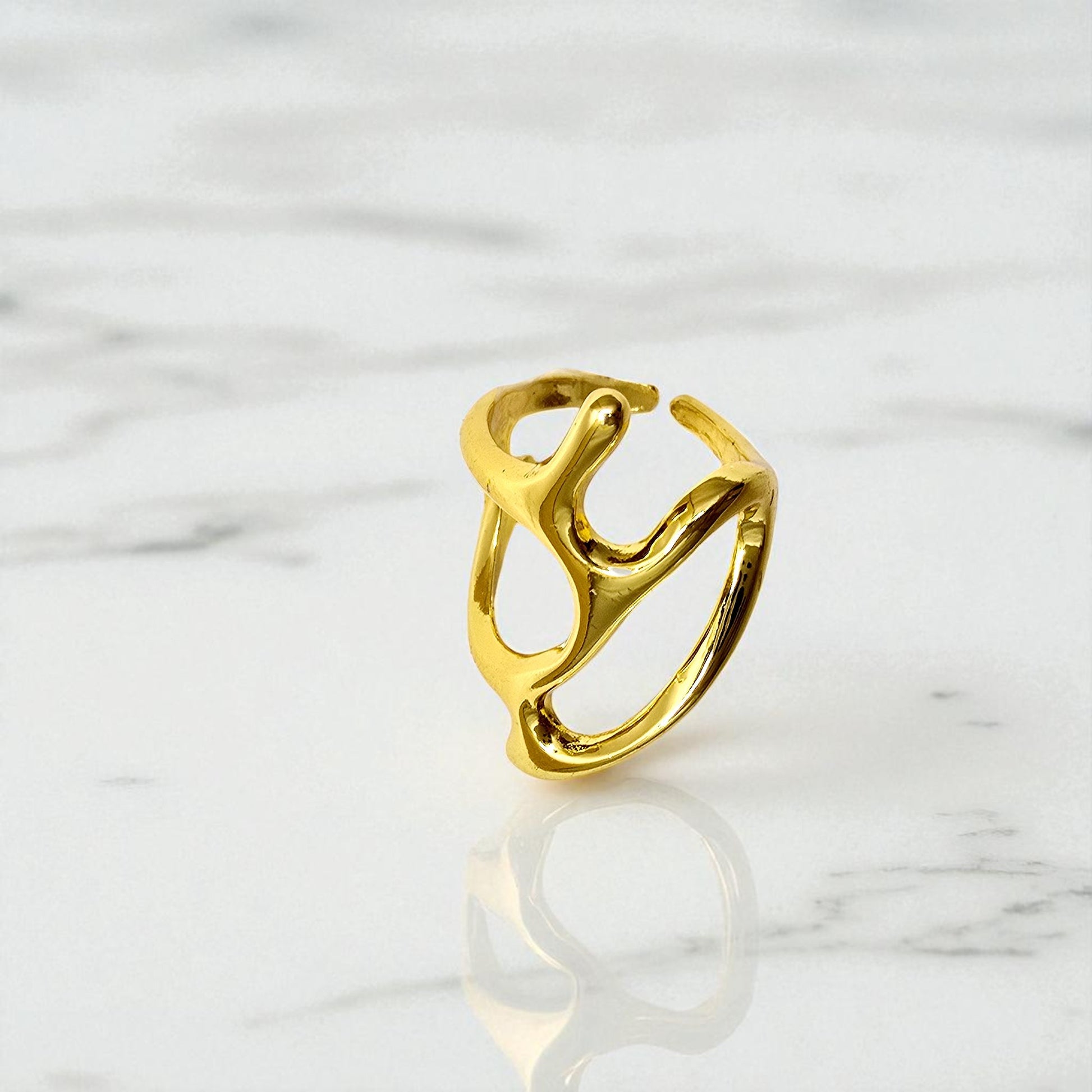 Close-up of Abstract Frame Ring displayed on a marble background