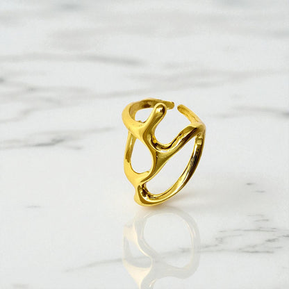 Close-up of Abstract Frame Ring displayed on a marble background