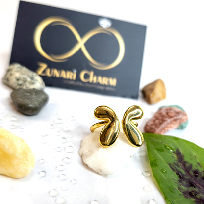 Angel Wings Ring in Zunari Charm lifestyle setup with brand card and natural props