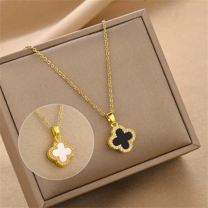 Gold Clover Pendant Chain in White Shell Enamel on jewelry box