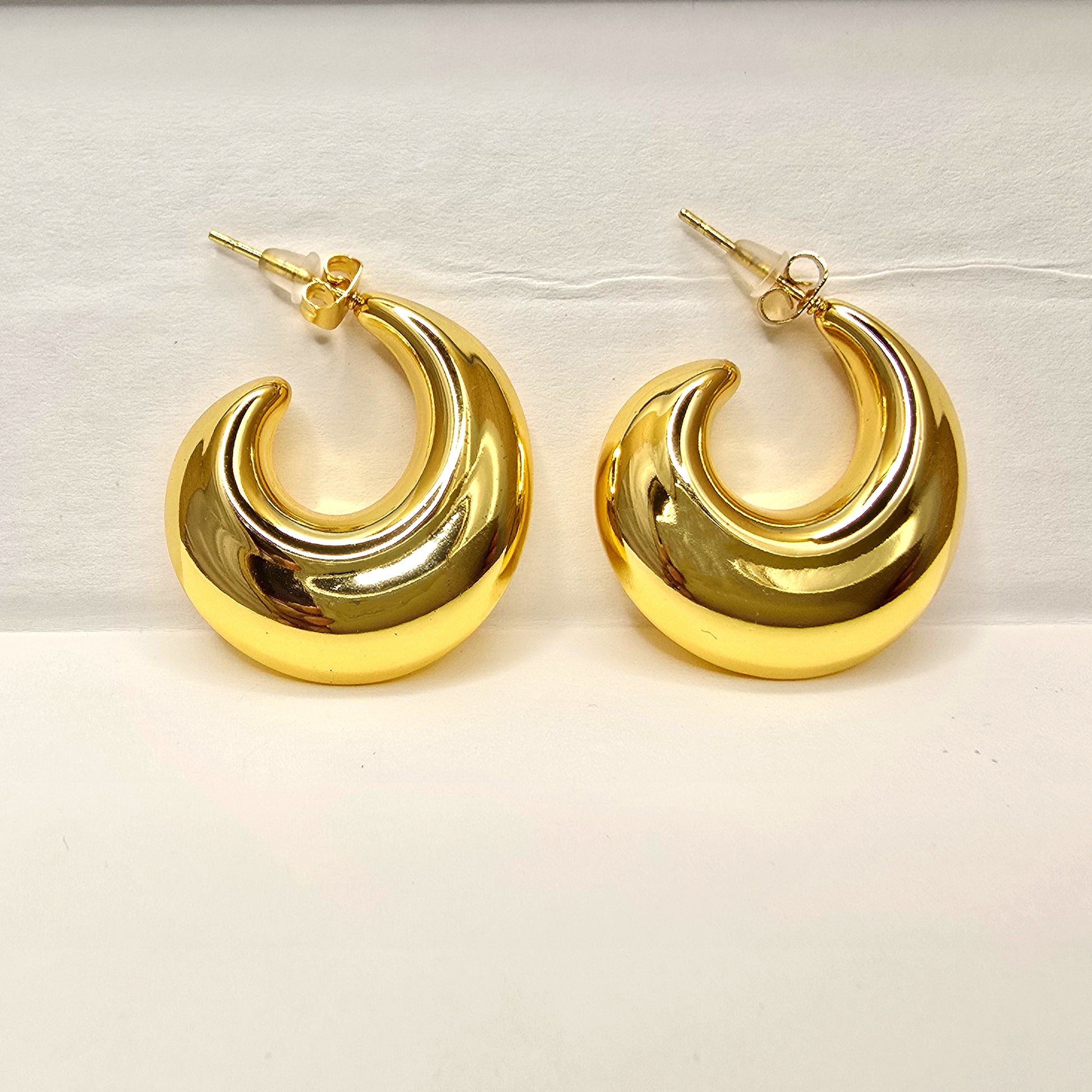 Close-up of Bold Loop Earrings displayed against a plain backdrop