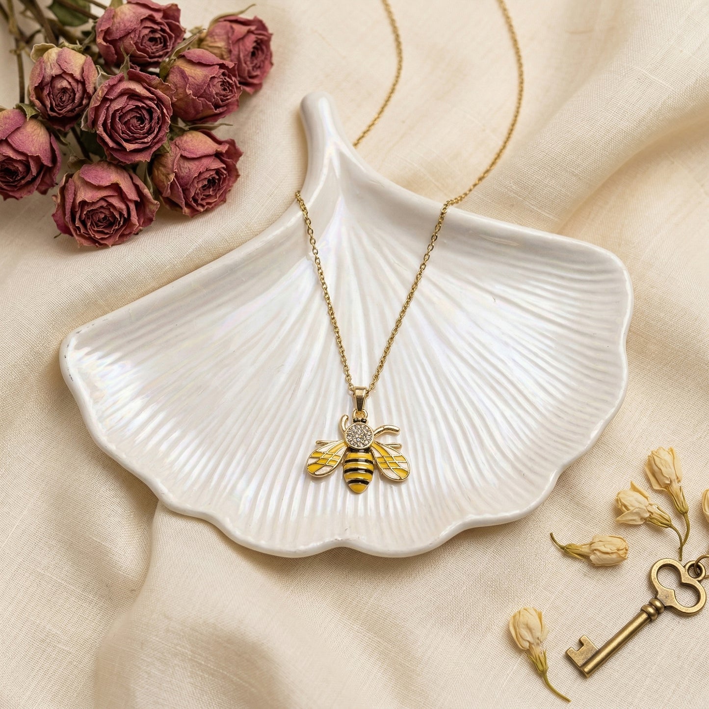 Honeybee pendant necklace aesthetic flatlay floral styling
