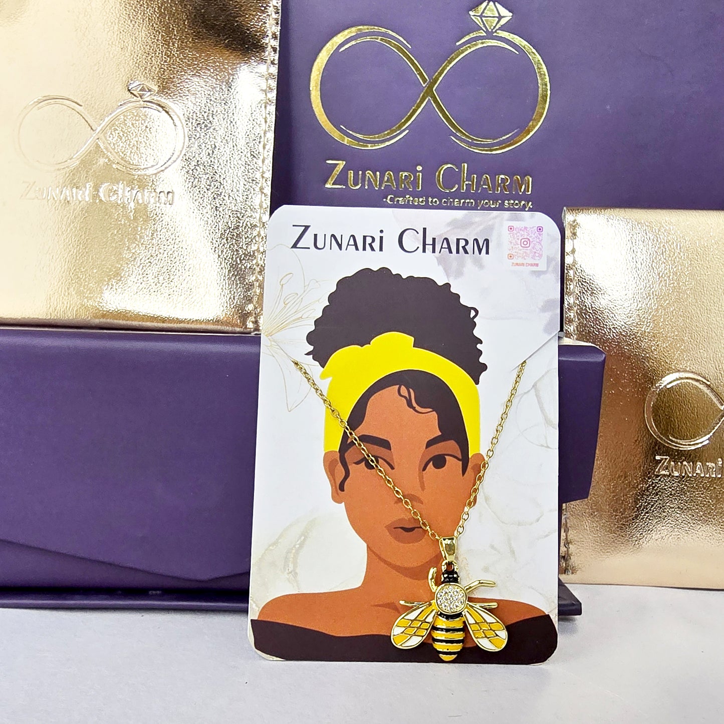 Zunari Charm honeybee pendant necklace packaging shot