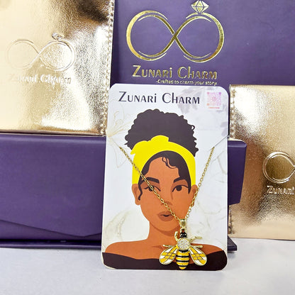 Zunari Charm honeybee pendant necklace packaging shot