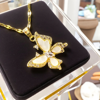 Crystal Butterfly Pendant displayed on black velvet – gold and crystal jewelry close-up