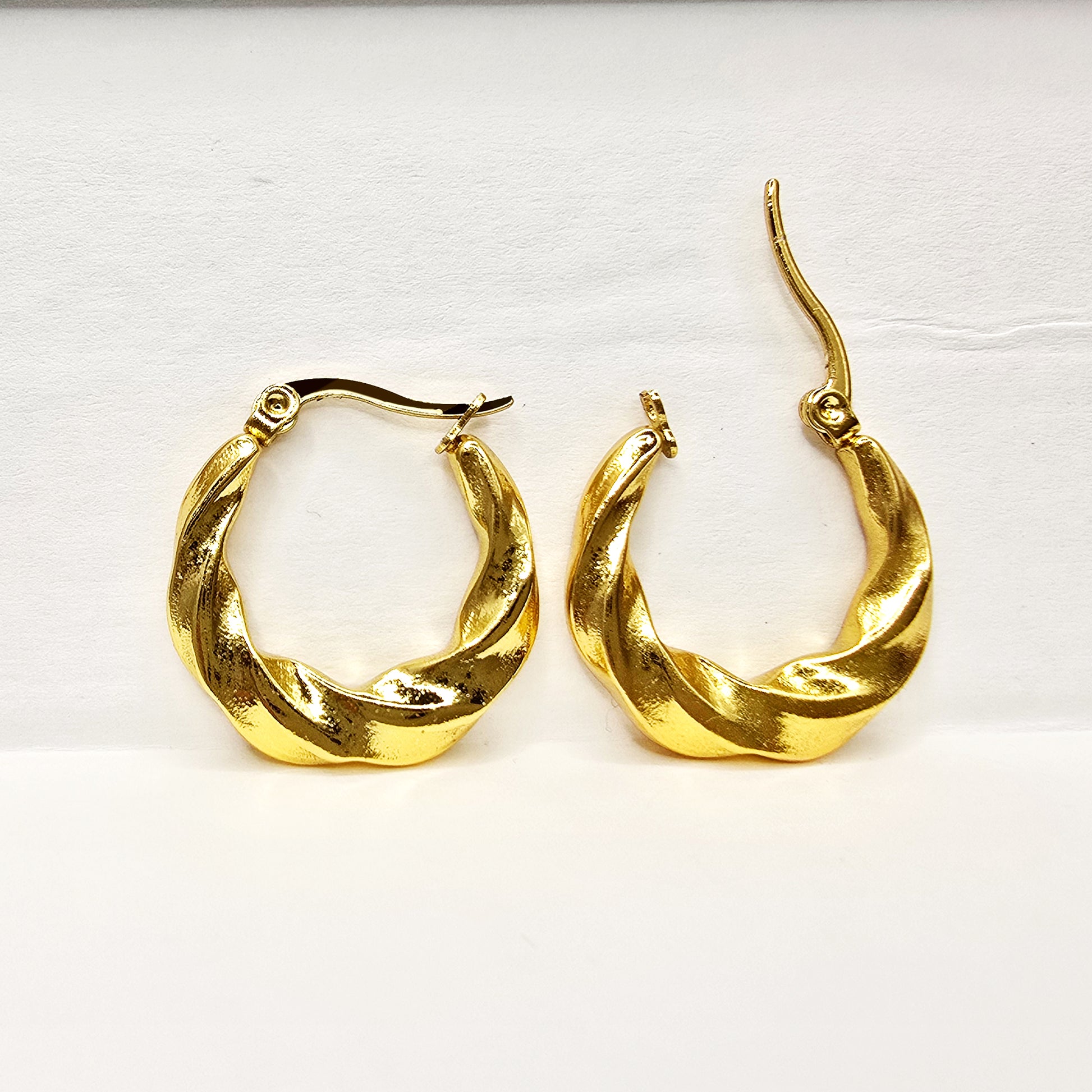 Curly Twist Earrings displayed on plain white background