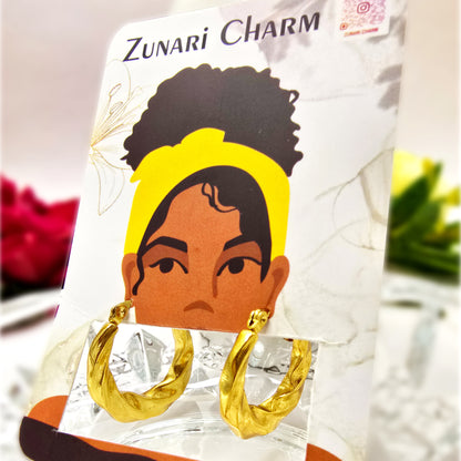 Earrings displayed on Zunari Charm branded jewelry card