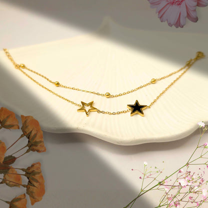double star layered bracelet gold anti tarnish jewelry displayed on a white shell tray