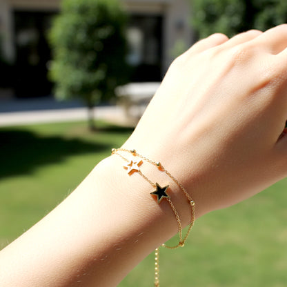 gold layered bracelet worn on hand stylish minimal jewelry