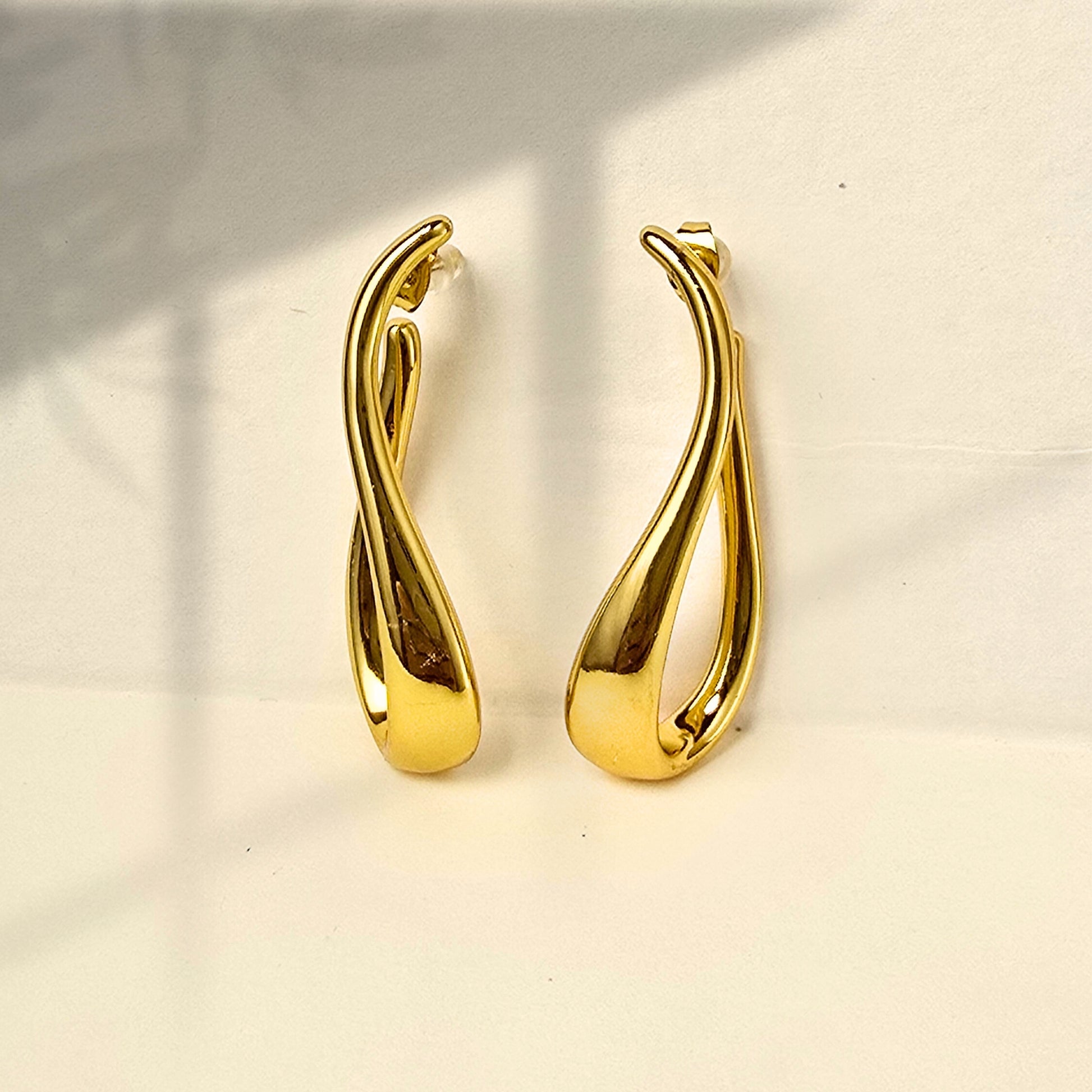 gold sculpt statement earrings minimal luxe design