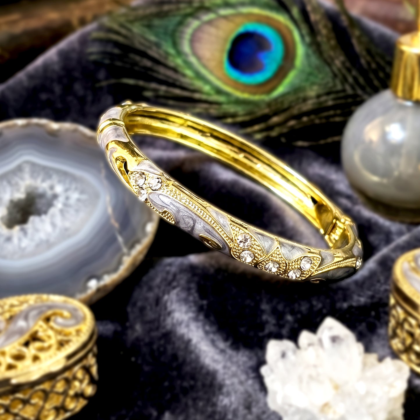 Luxury ash bracelet with crystal stones styled on velvet tray
