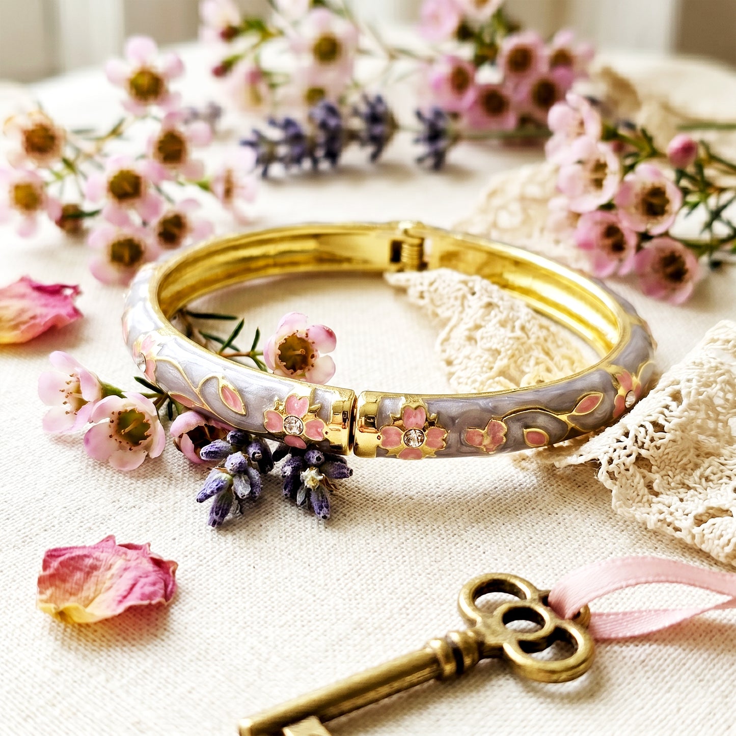 Floral grey bracelet styled with flowers and vintage key