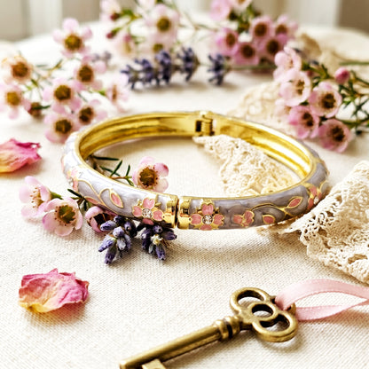 Floral grey bracelet styled with flowers and vintage key