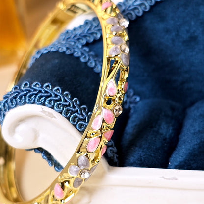 Pink enamel floral crystal bangle bracelet close-up view