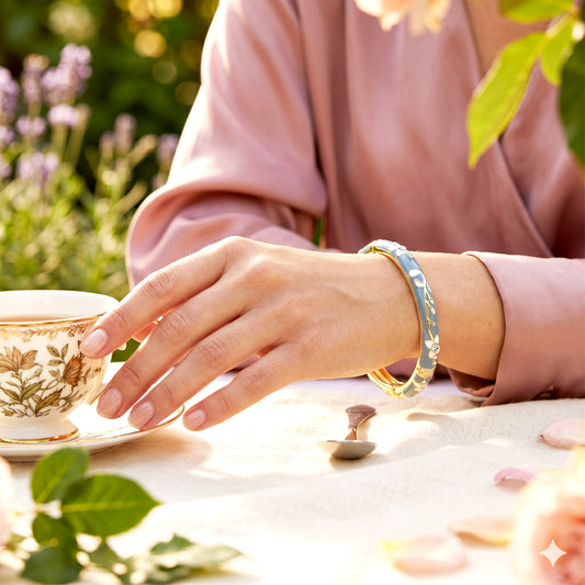 Woman wearing teal floral enamel bangle bracelet outdoors