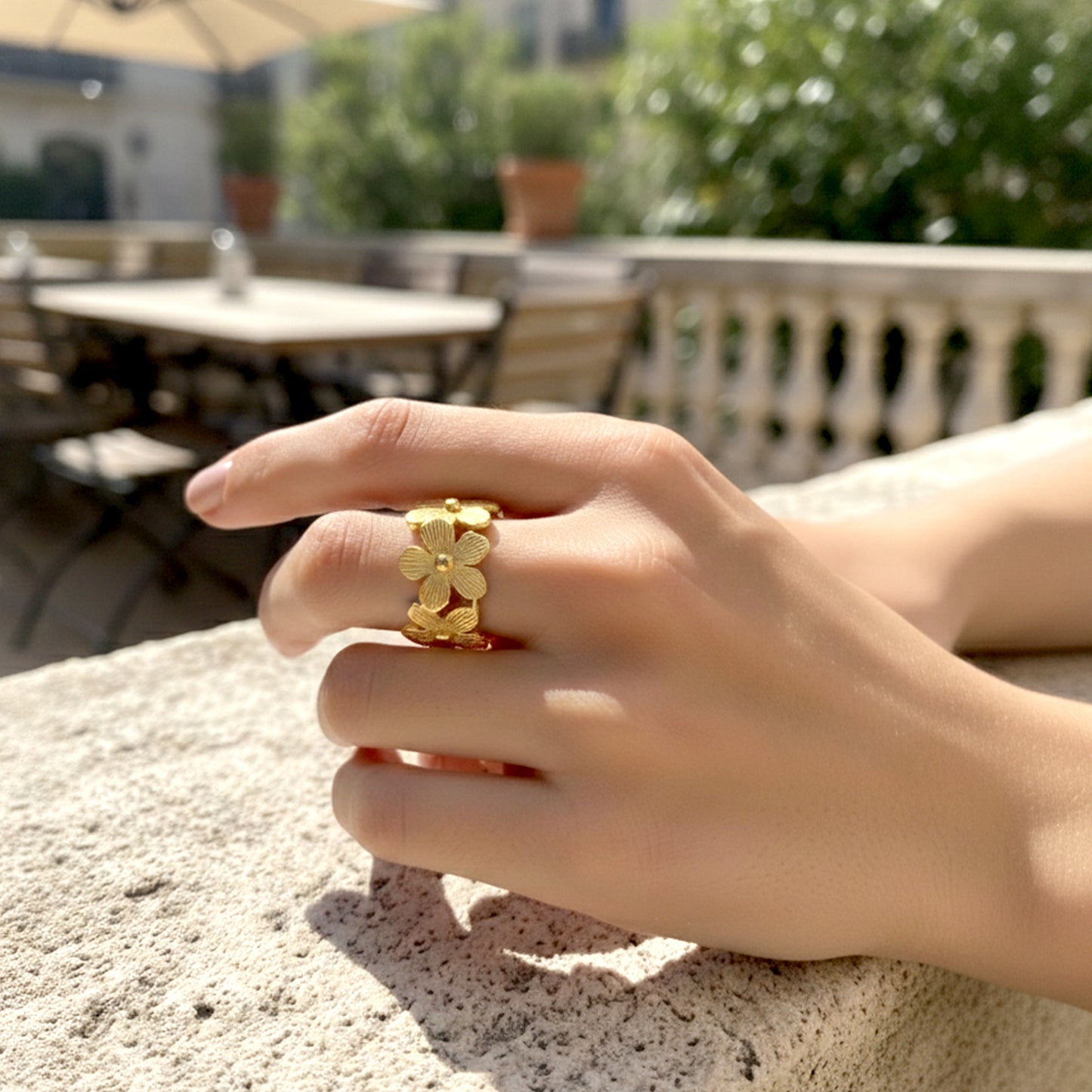 floral gold ring on hand aesthetic styling
