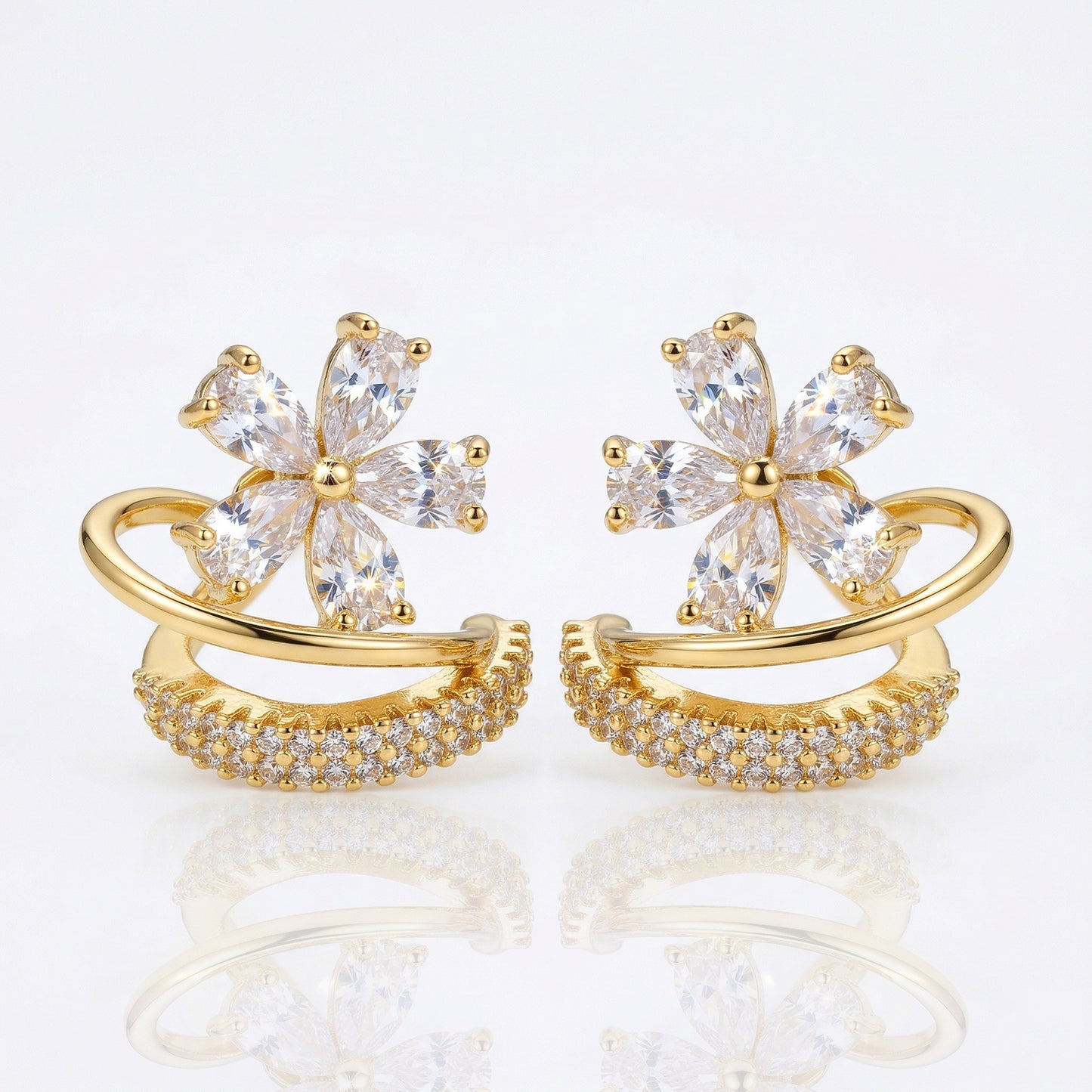 Gold floral zircon hoop earrings front view white background
