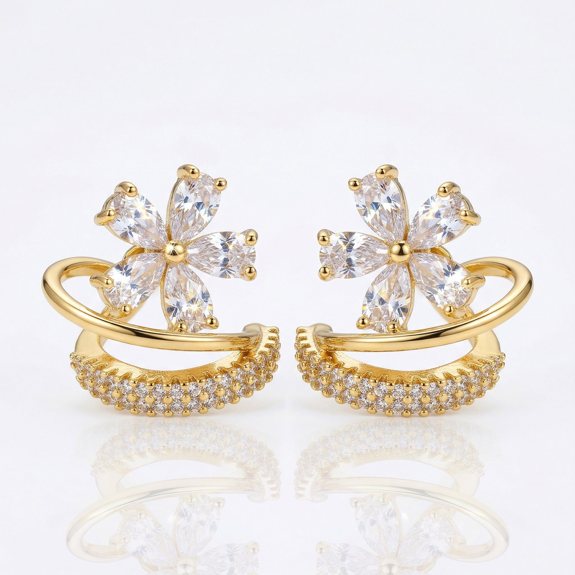 Gold floral zircon hoop earrings front view white background