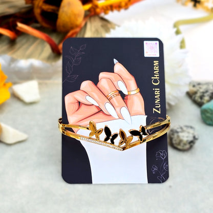 Flutter V-Cuff bangle displayed on Zunari Charm branded packaging card.