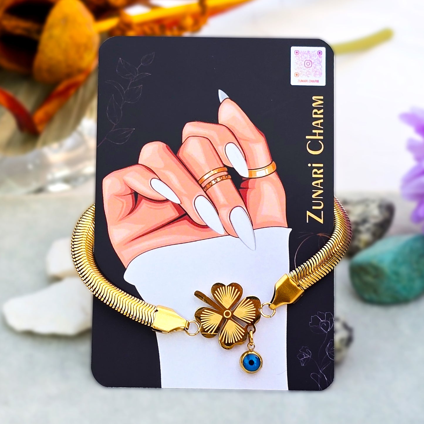 Fortuna clover anti-tarnish bracelet displayed on Zunari Charm branded packaging card.
