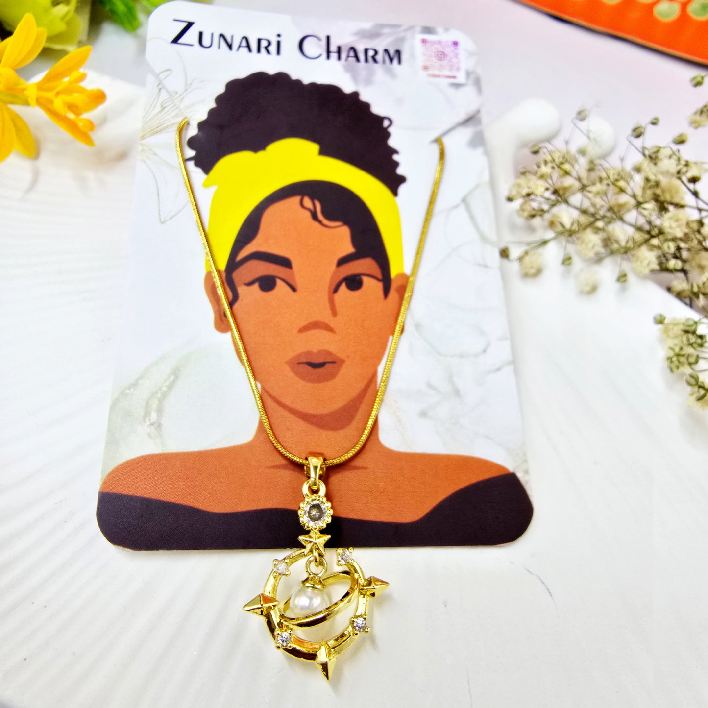 Galaxy Charm Pendant Chain on Zunari Charm packaging card – yellow headband model illustration.