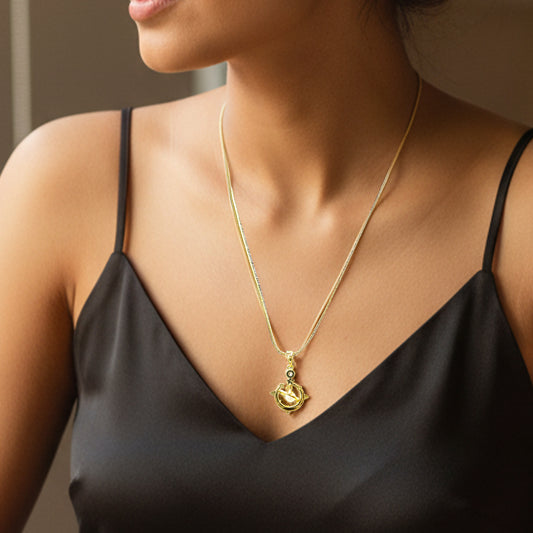 Model wearing Galaxy Charm Pendant Chain – elegant gold necklace paired with black satin dress.