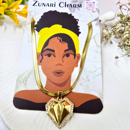 Zunari Charm geometric heart pendant on a wide chain, displayed on a branded jewelry card.