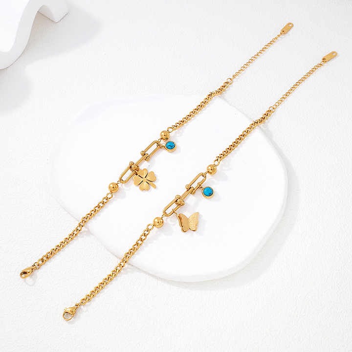 Zunari Charm gold charm bracelet with adjustable clasp and zircon accents