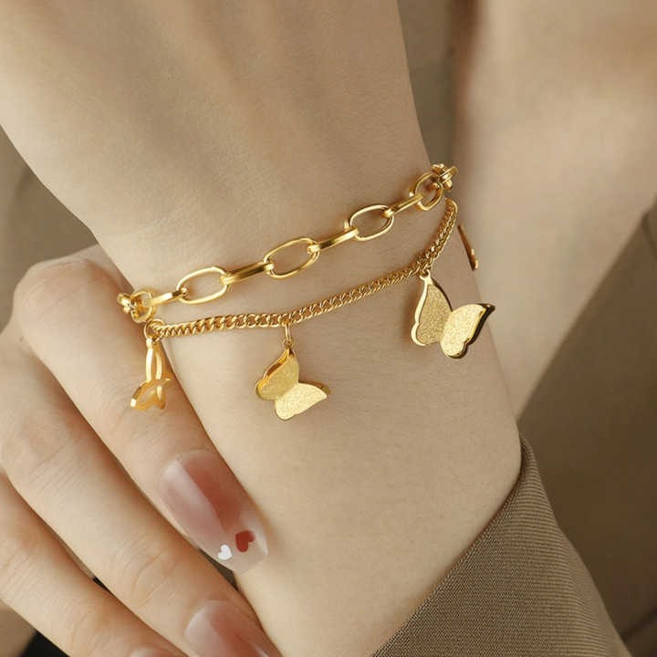 Worn by hand – soft feminine styling with butterflies