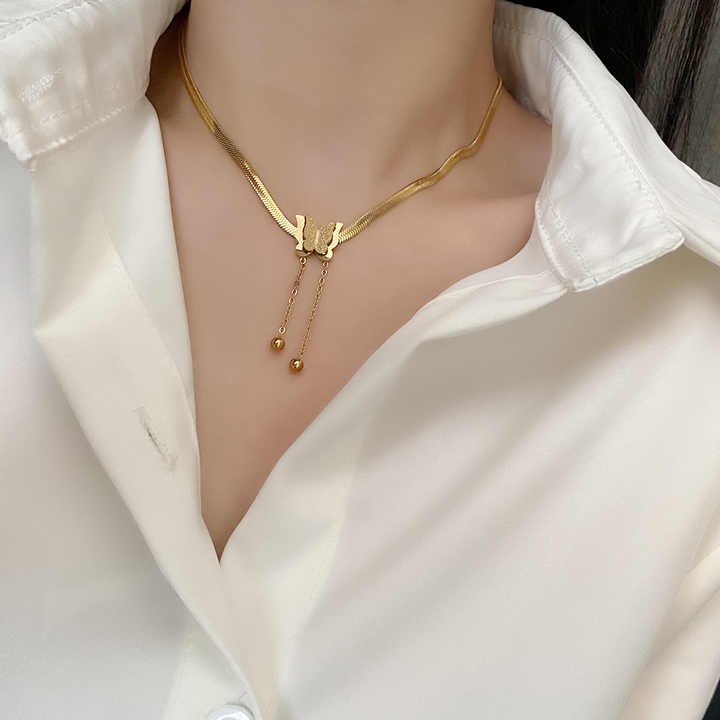 Minimalist gold necklace styled on formal outfit
