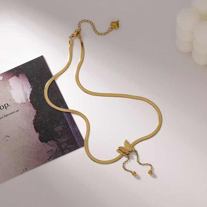 Statement butterfly necklace with gold beads