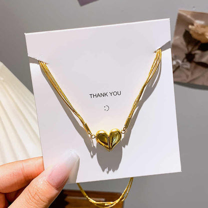 Magnetic heart necklace displayed on thank-you card packaging