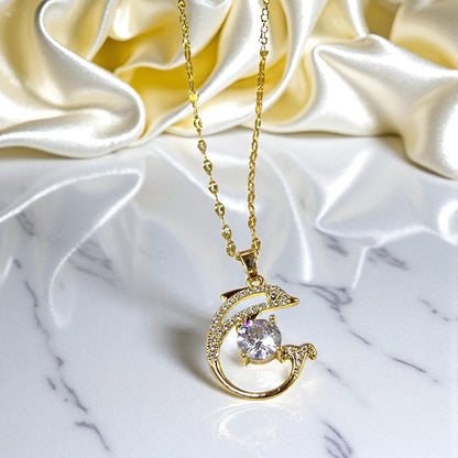 Dolphin Pendant Chain on satin and marble surface showing luxurious finish.