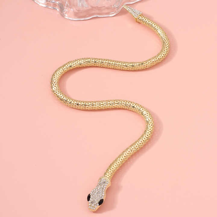 Full extended view of snake chain on pink background – luxurious and flexible design.