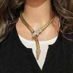 Model with long hair wearing crystal snake necklace over a white top – everyday bold styling