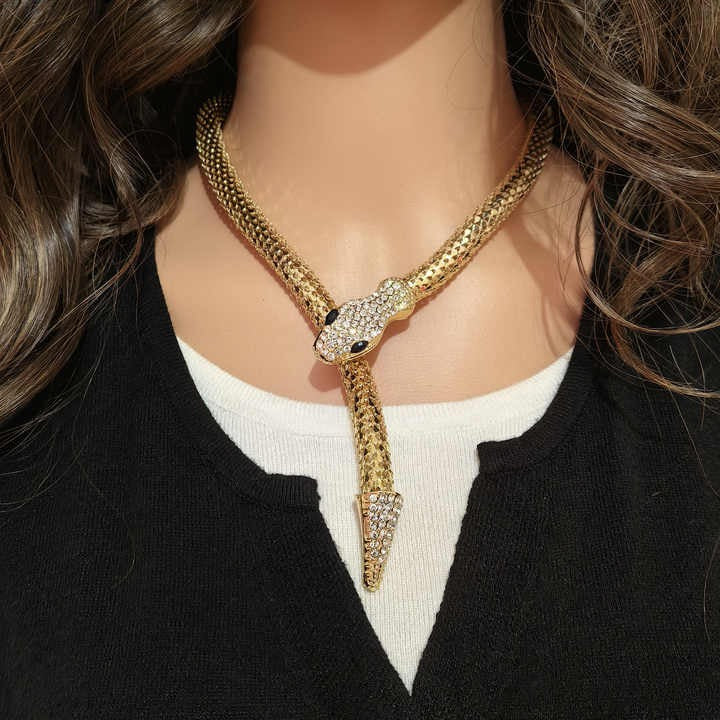 Model with long hair wearing crystal snake necklace over a white top – everyday bold styling