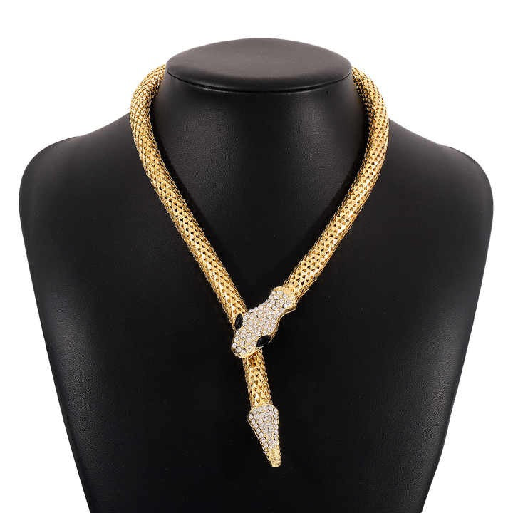 Serpent necklace on black bust display – statement jewelry with glam appeal.