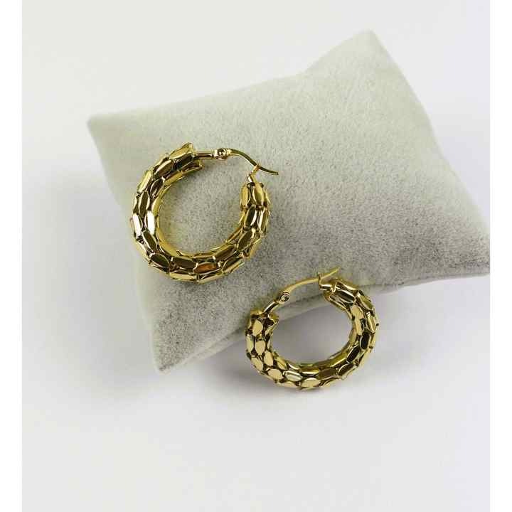 Snake scale hoops placed on soft cushion for presentation