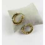 Snake scale hoops placed on soft cushion for presentation
